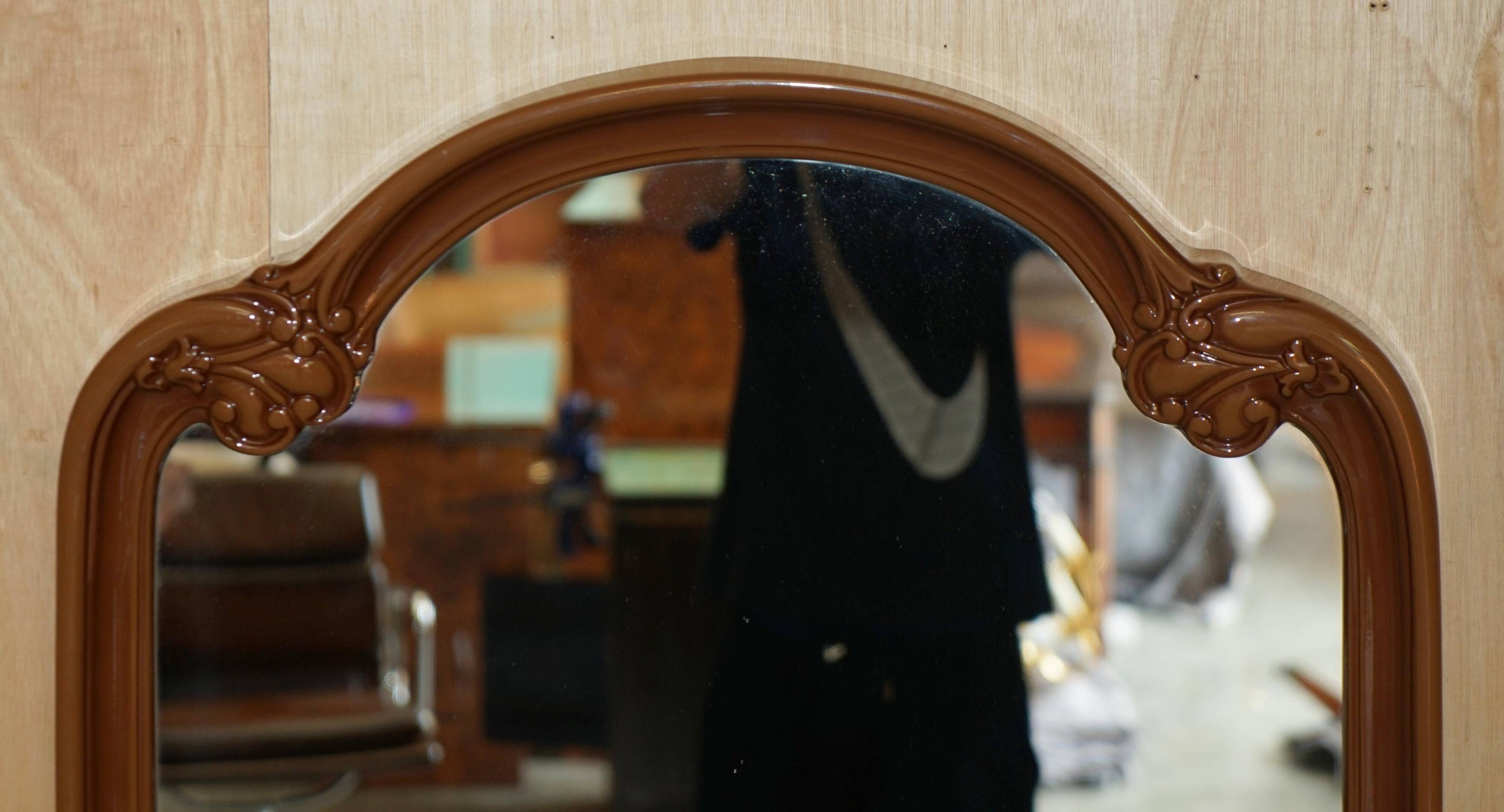 Vintage Art Deco decorative mirror with a thick frame.