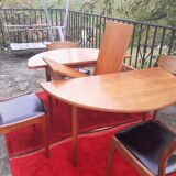 Roundtable with extension cords and chairs from the 1960s
