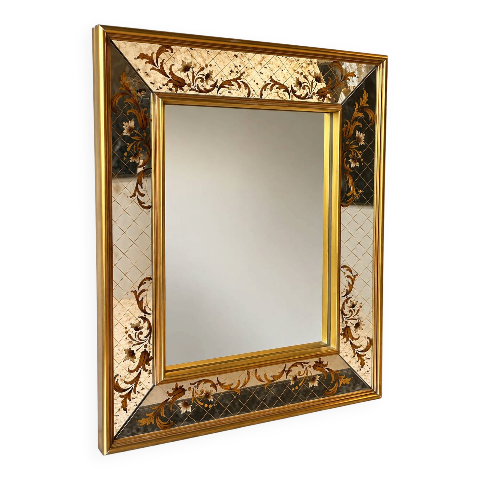 Large Venetian-style mirror with golden floral decoration.