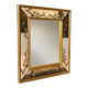 Large Venetian-style mirror with golden floral decoration.