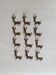12 bronze and brass knife rests, African art, gazelles