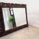 Beveled carved wood mirror 110x84cm