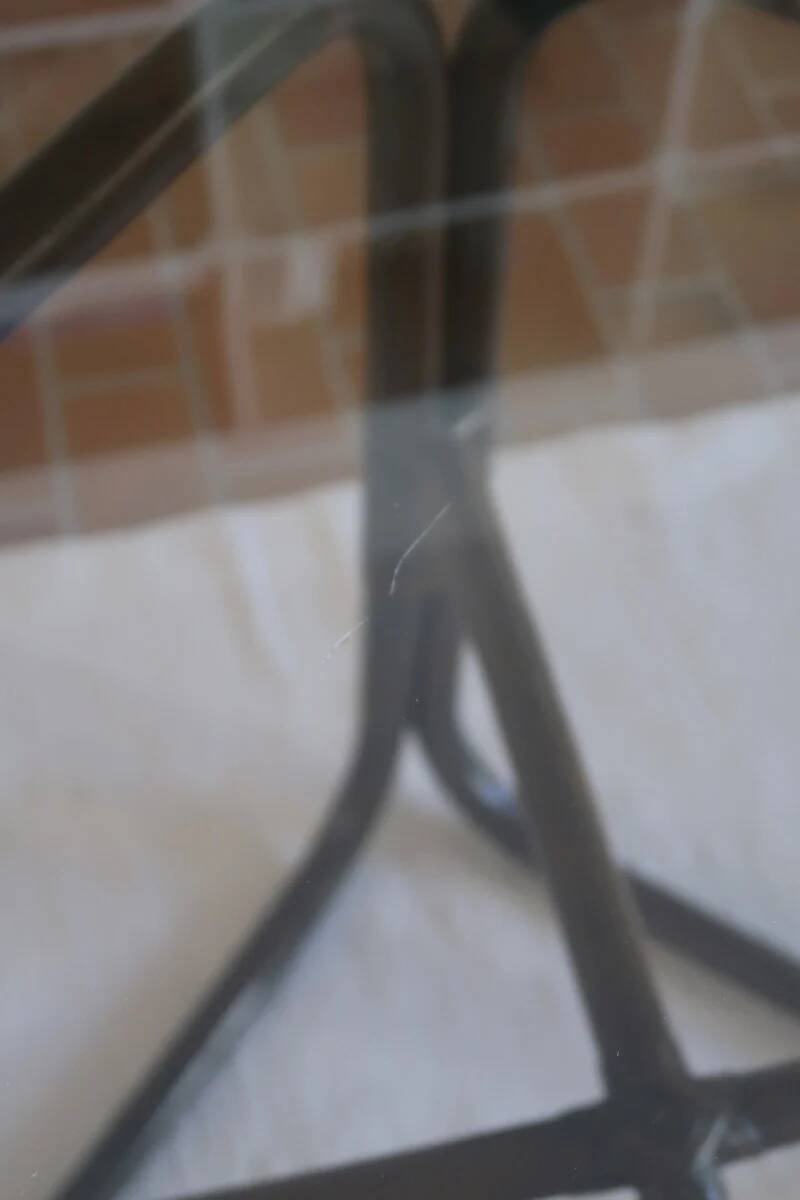 Round dining table in rattan, smoked glass top, 1970s.