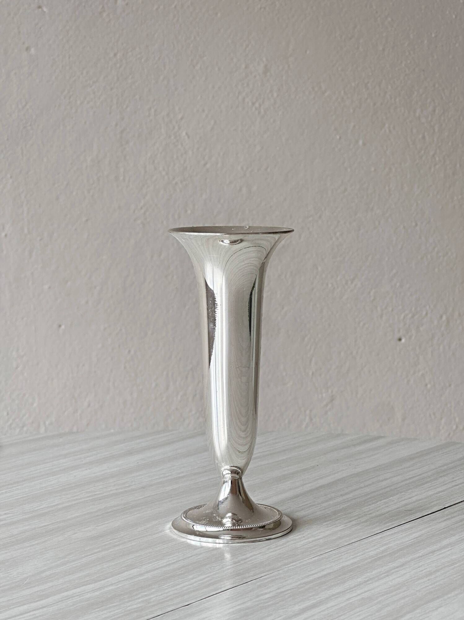 Light silver metal single-stem vase