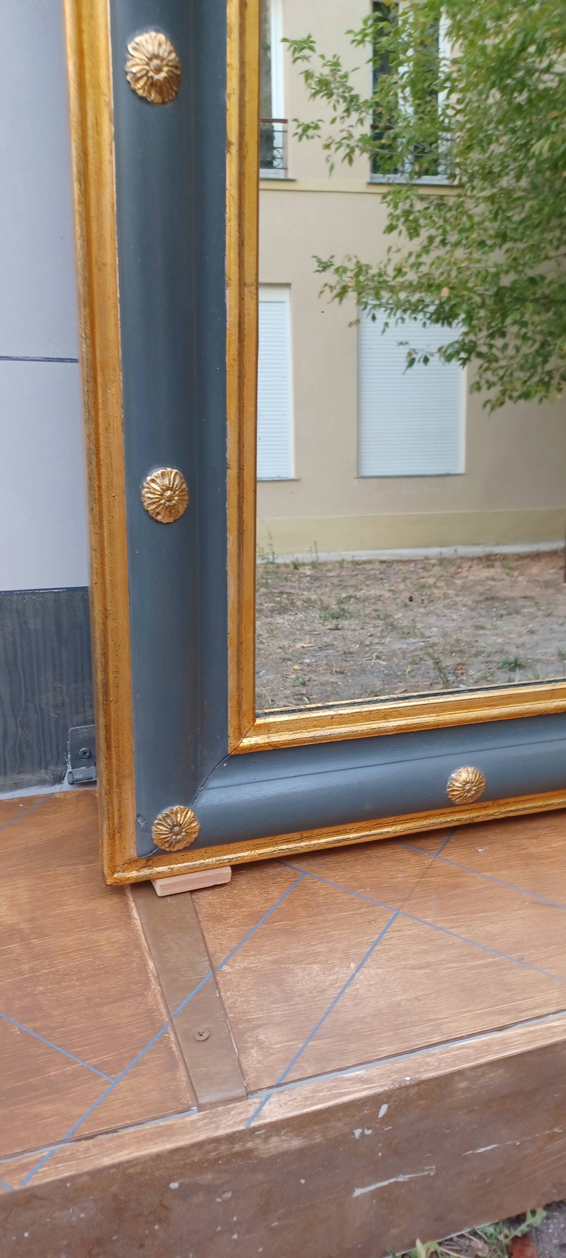 Louis-philippe grey and gilt mirror decorated in the antique style