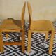 Pair of light wood chairs with post-formed seat and backrest.