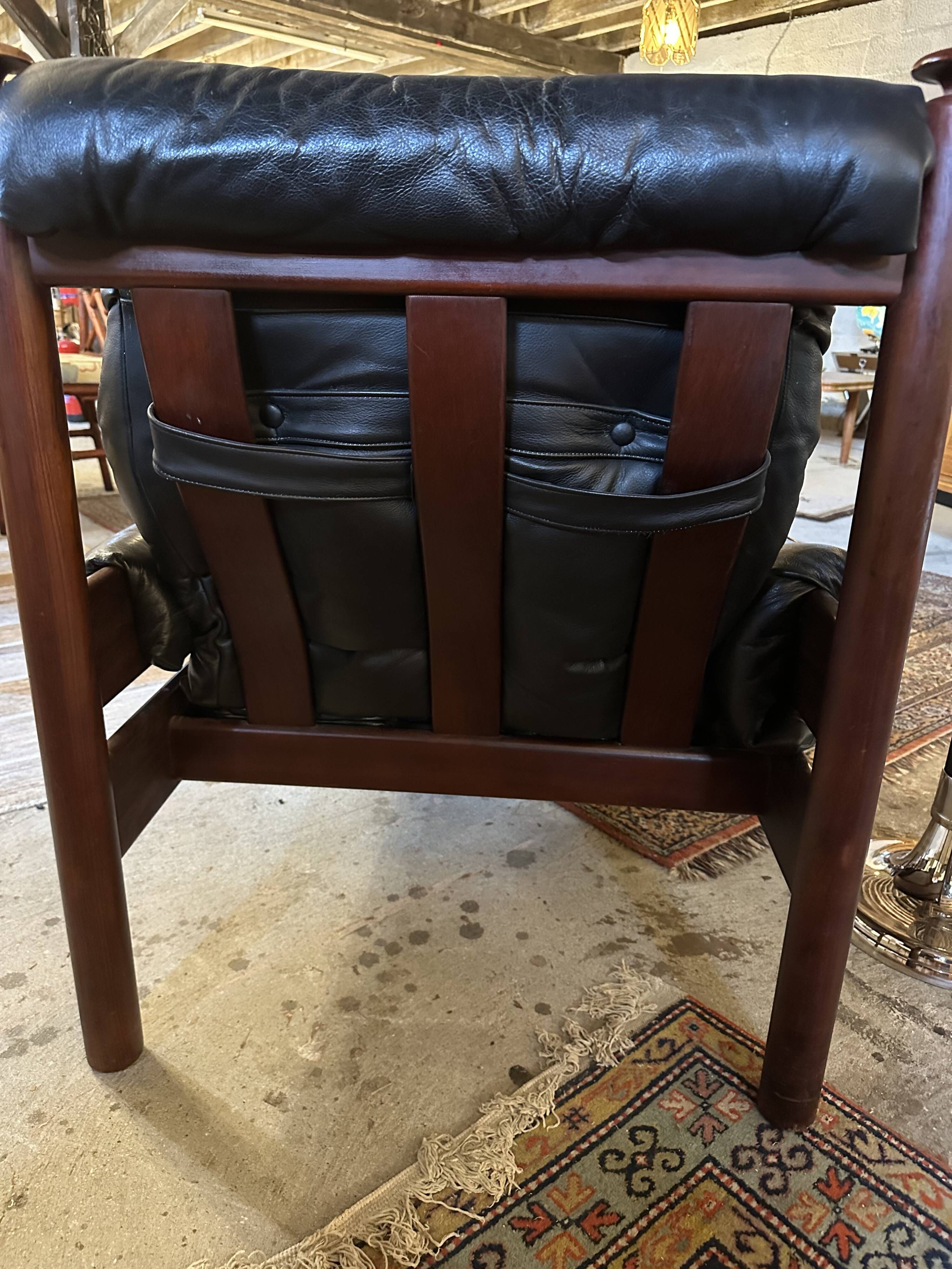 Admiral armchair and its ottoman by Erik Merthen Sweden vintage 1960