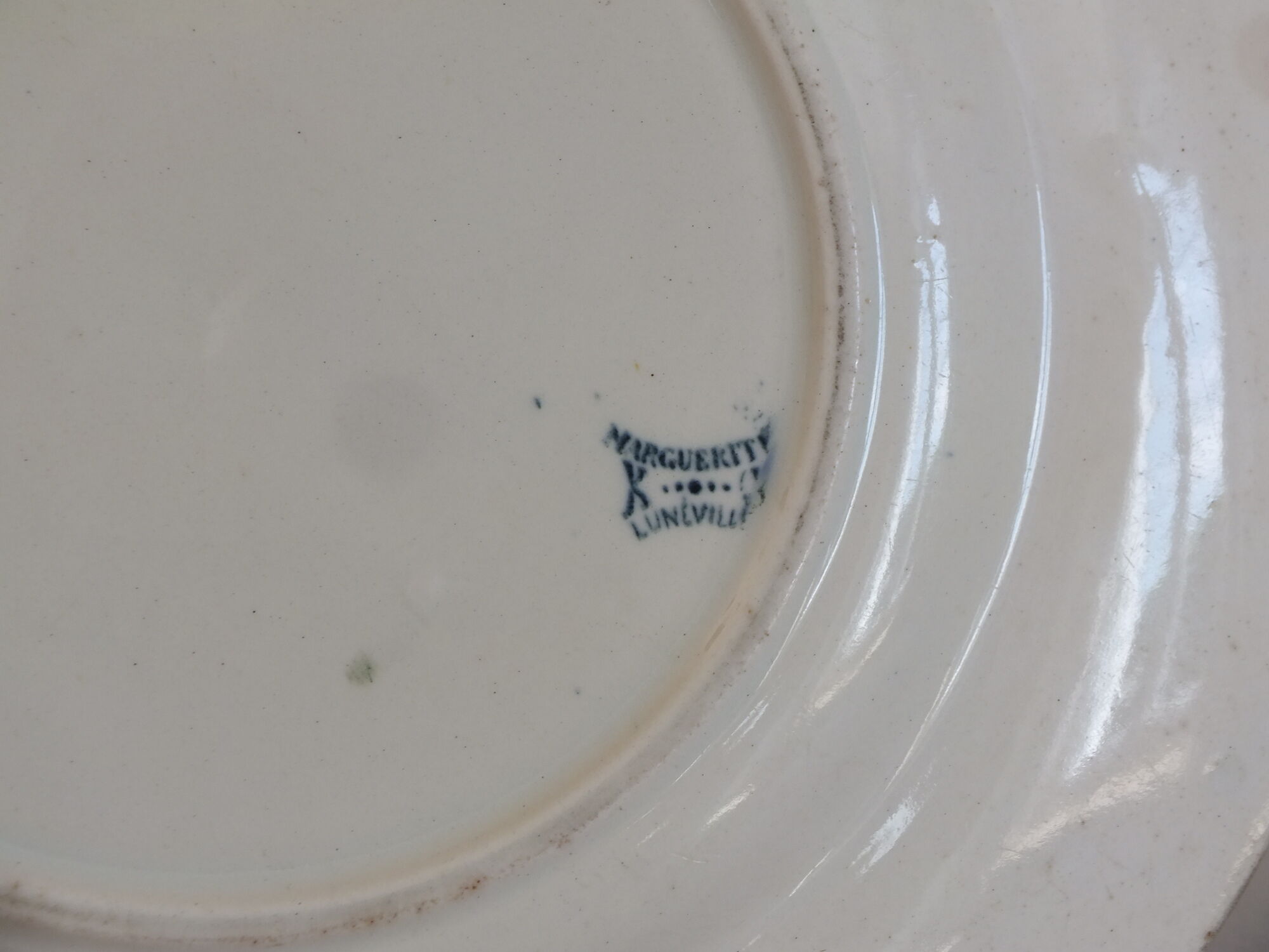 Old round dish in Terre de Fer Lunéville KG Marguerite