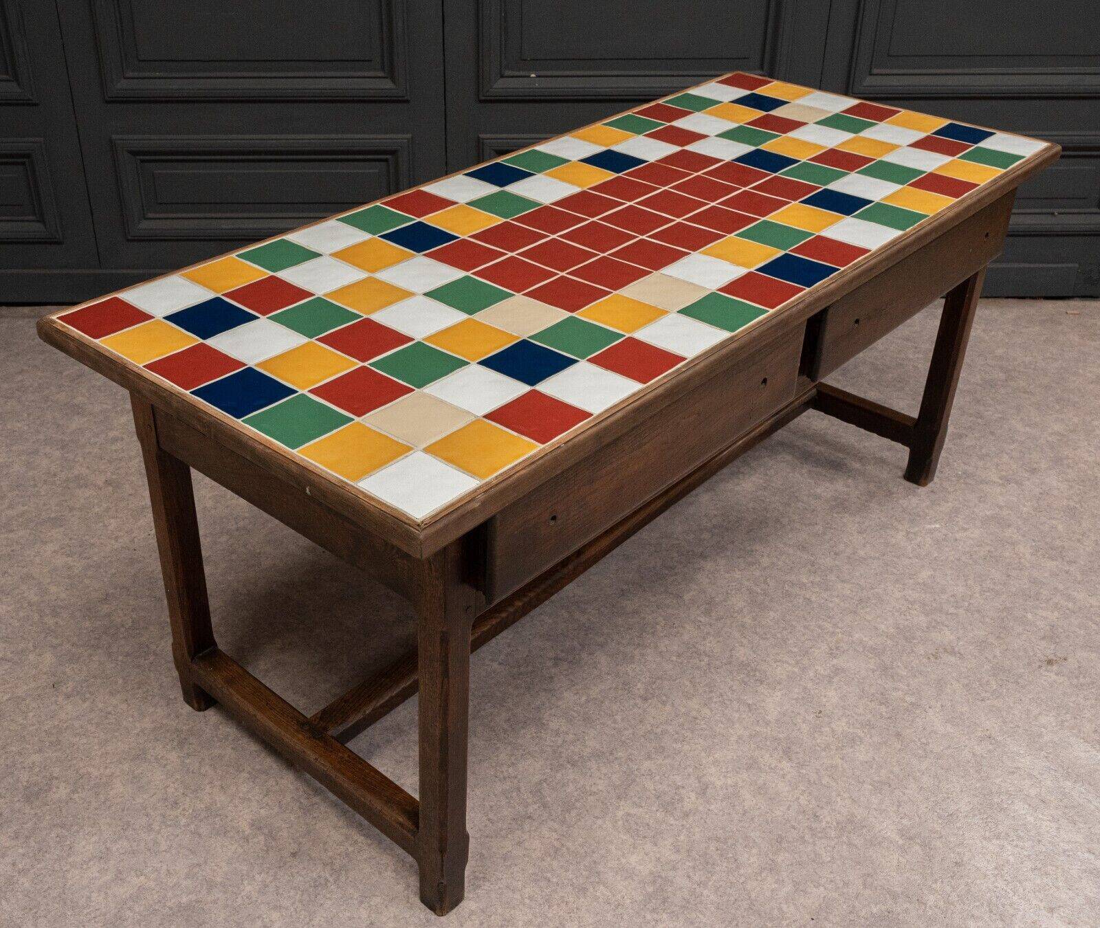 19th century oak farm table with multi-colored ceramic tiles