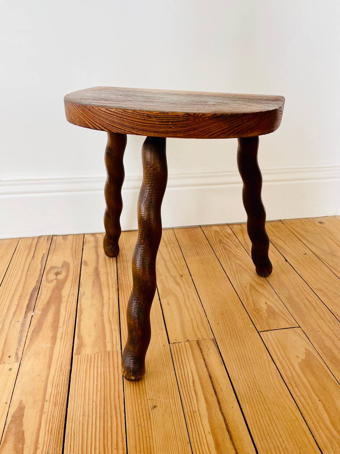 Vintage wooden half-moon tripod stool with twisted legs