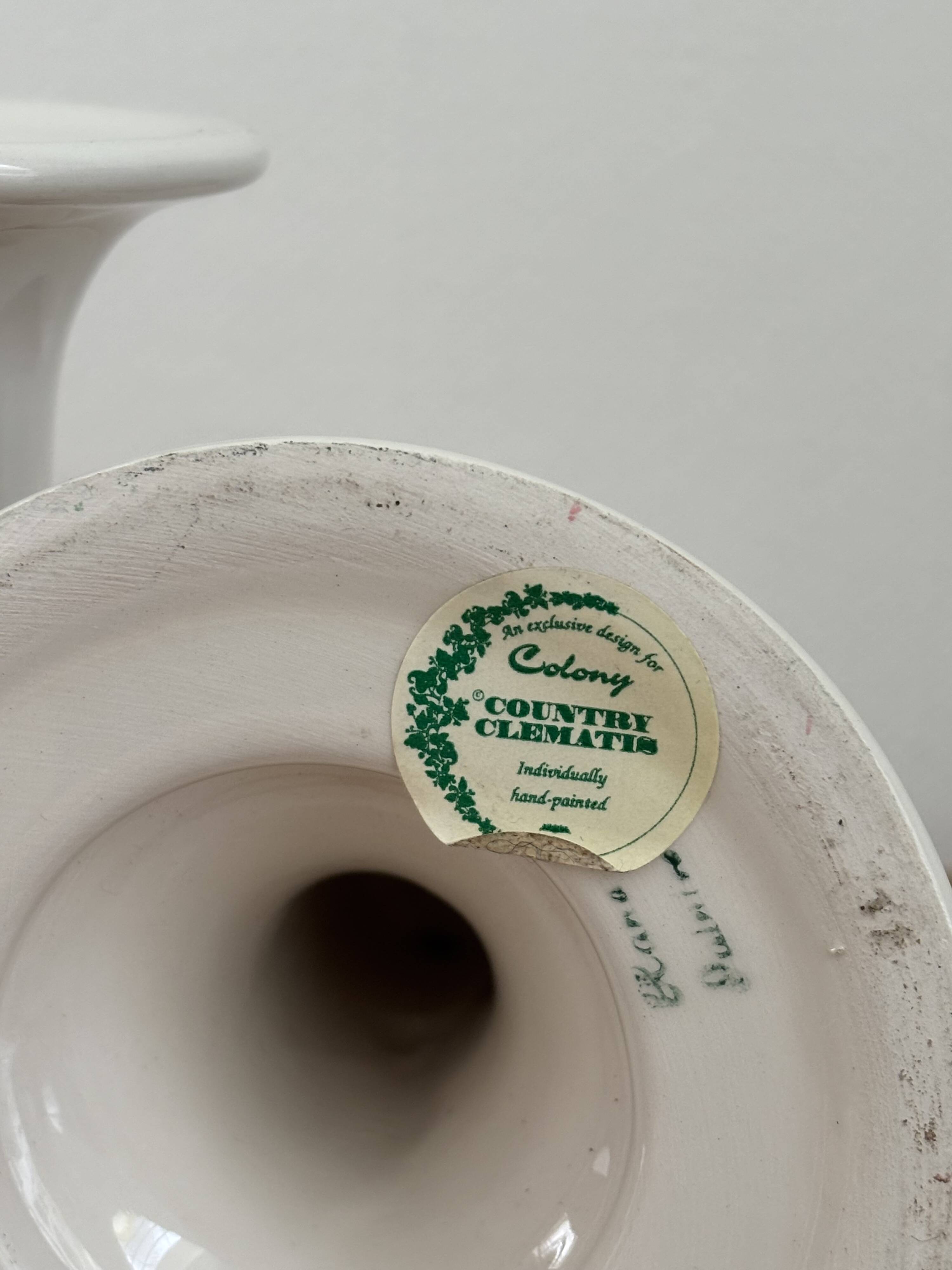 Pair of hand-painted English porcelain candlesticks