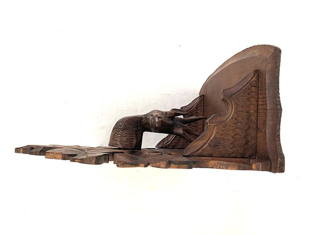 Pair of carved wooden wall consoles decorated with a deer's head
