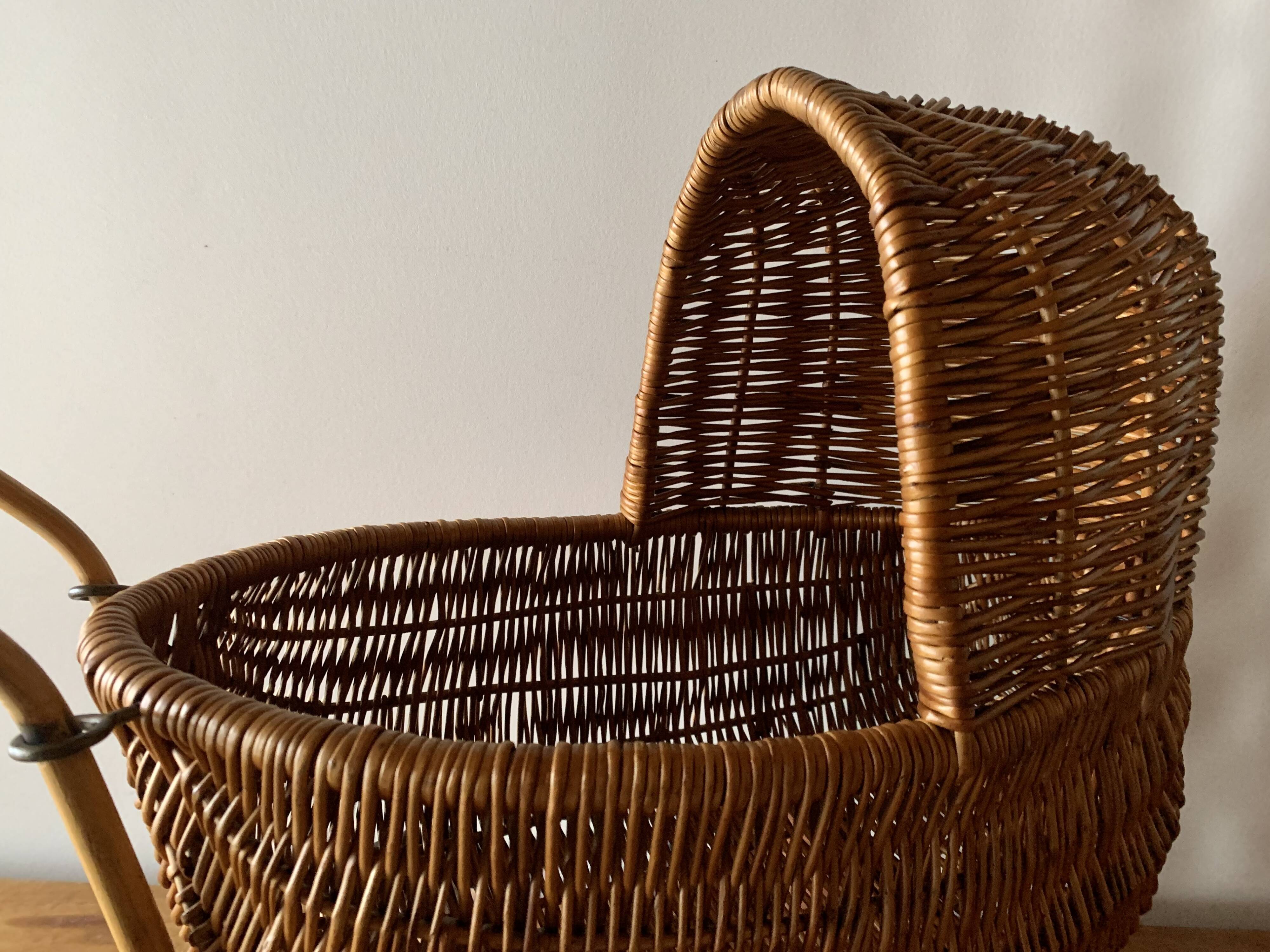 Old wicker dolls' pram - wooden wheels
