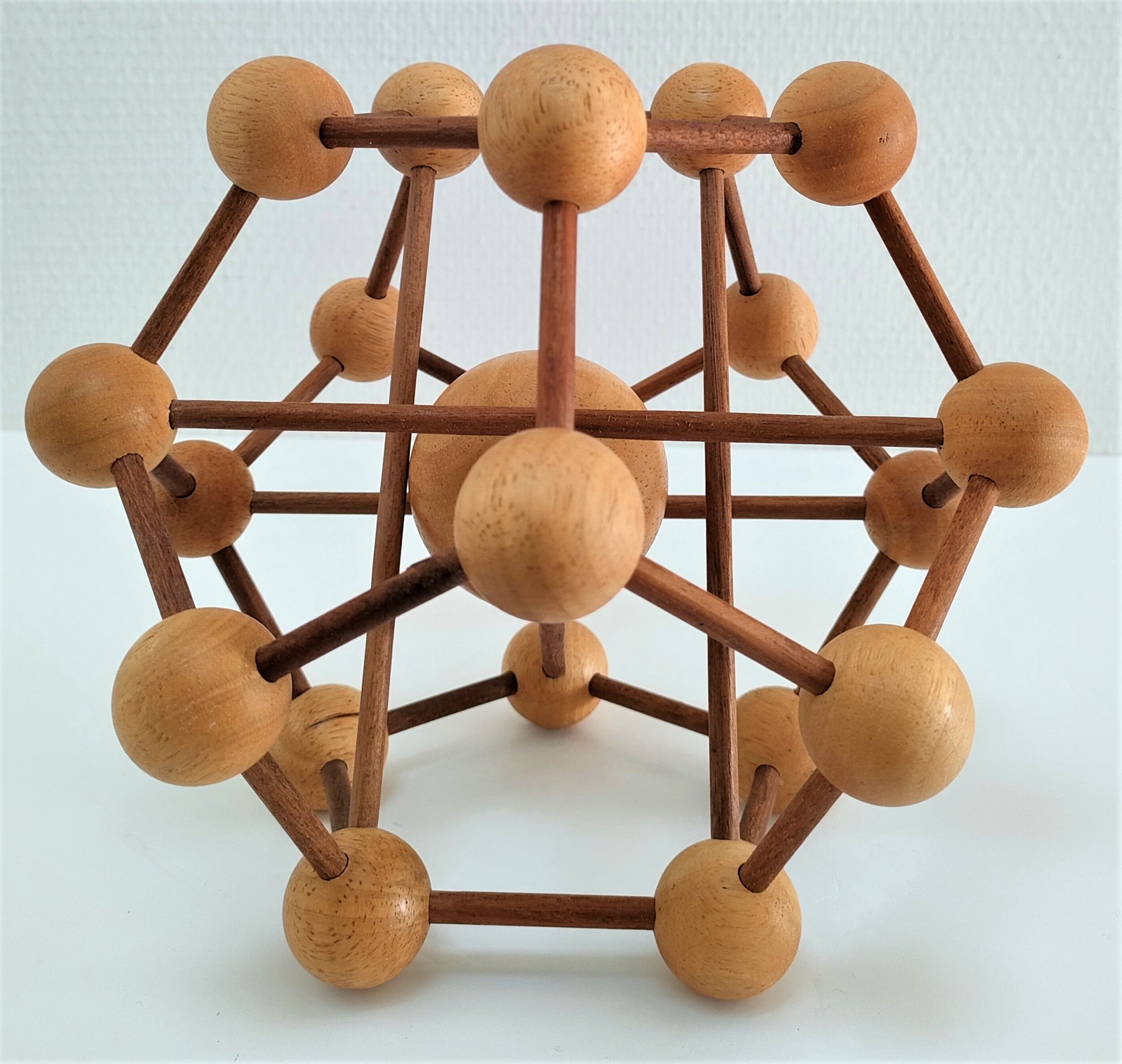 Sculptural modeling of a solid wood atom contemporary design