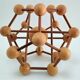 Sculptural modeling of a solid wood atom contemporary design