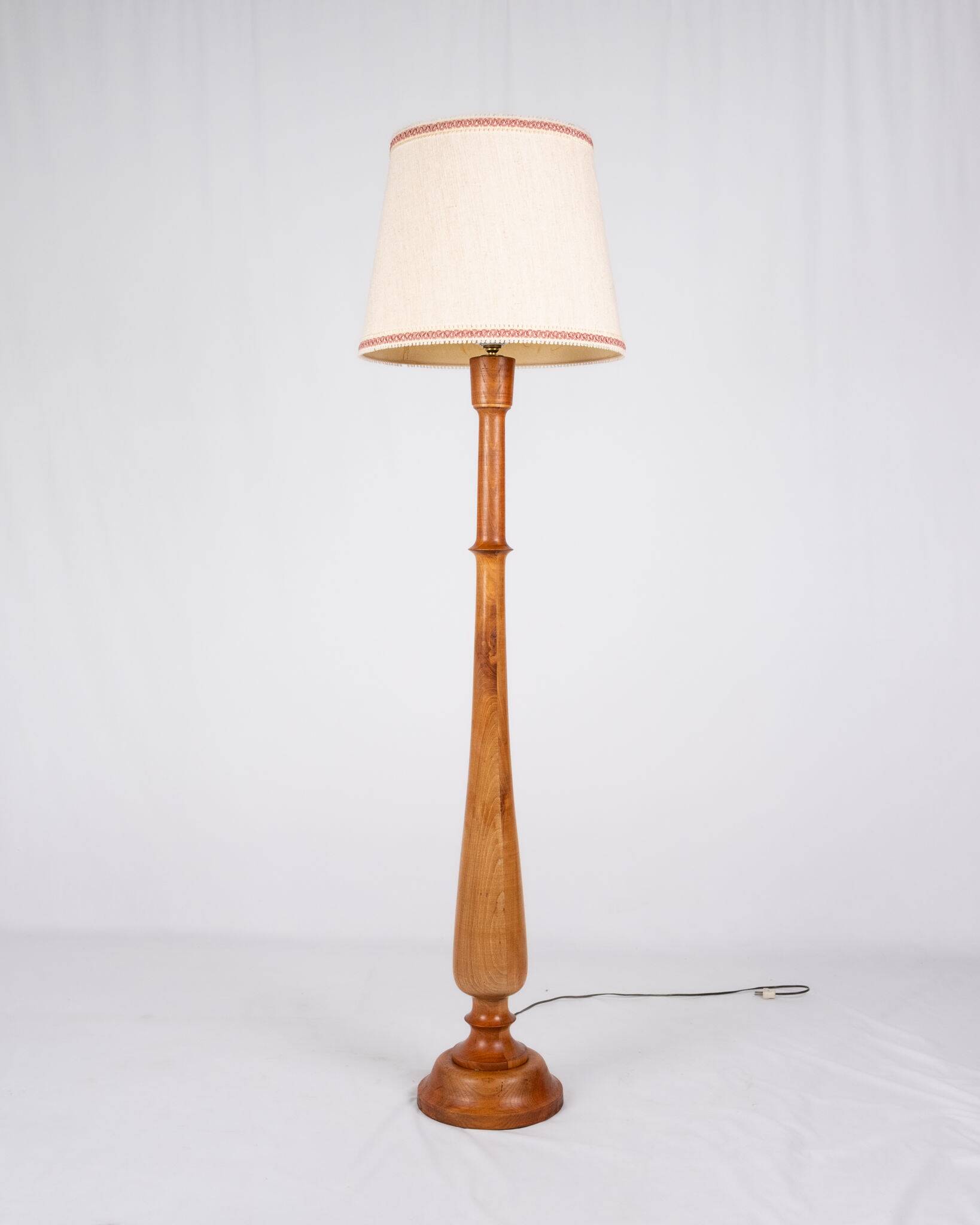 Pair of turned wooden floor lamps in Art Deco style, France, mid-20th century.