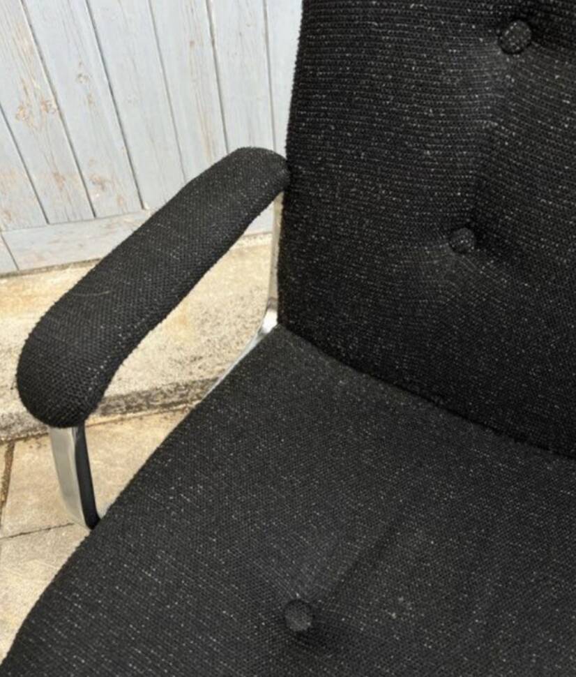 Black mottled fabric and chrome swivel armchair, 1