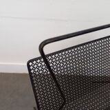 1950s magazine rack in perforated sheet metal