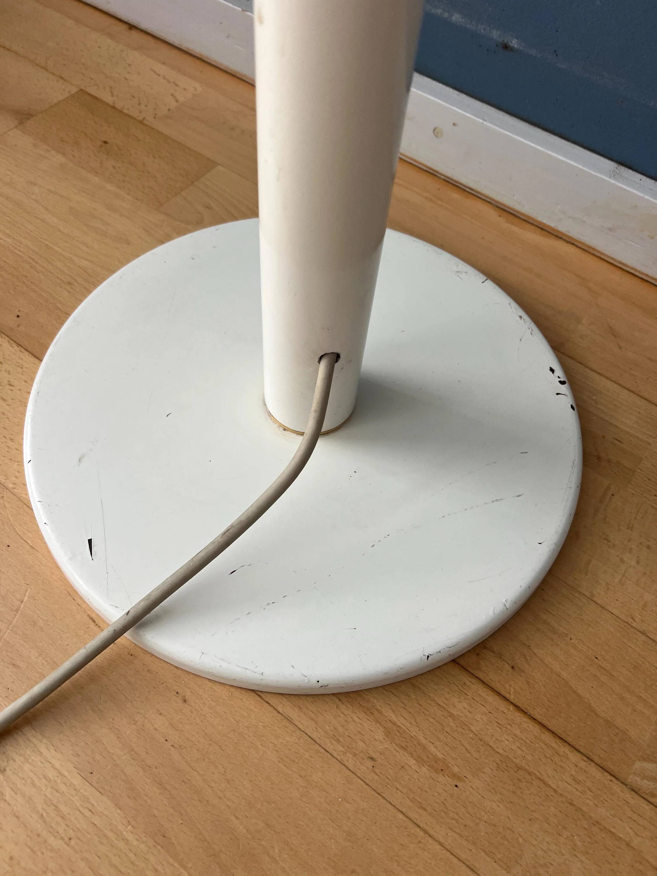 Mid-century mushroom floor lamp with a white plexiglass shade.