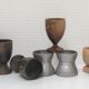 Set of twelve turned wood shells and vintage aluminum