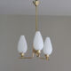 Brass chandelier and tulips in vintage white glass