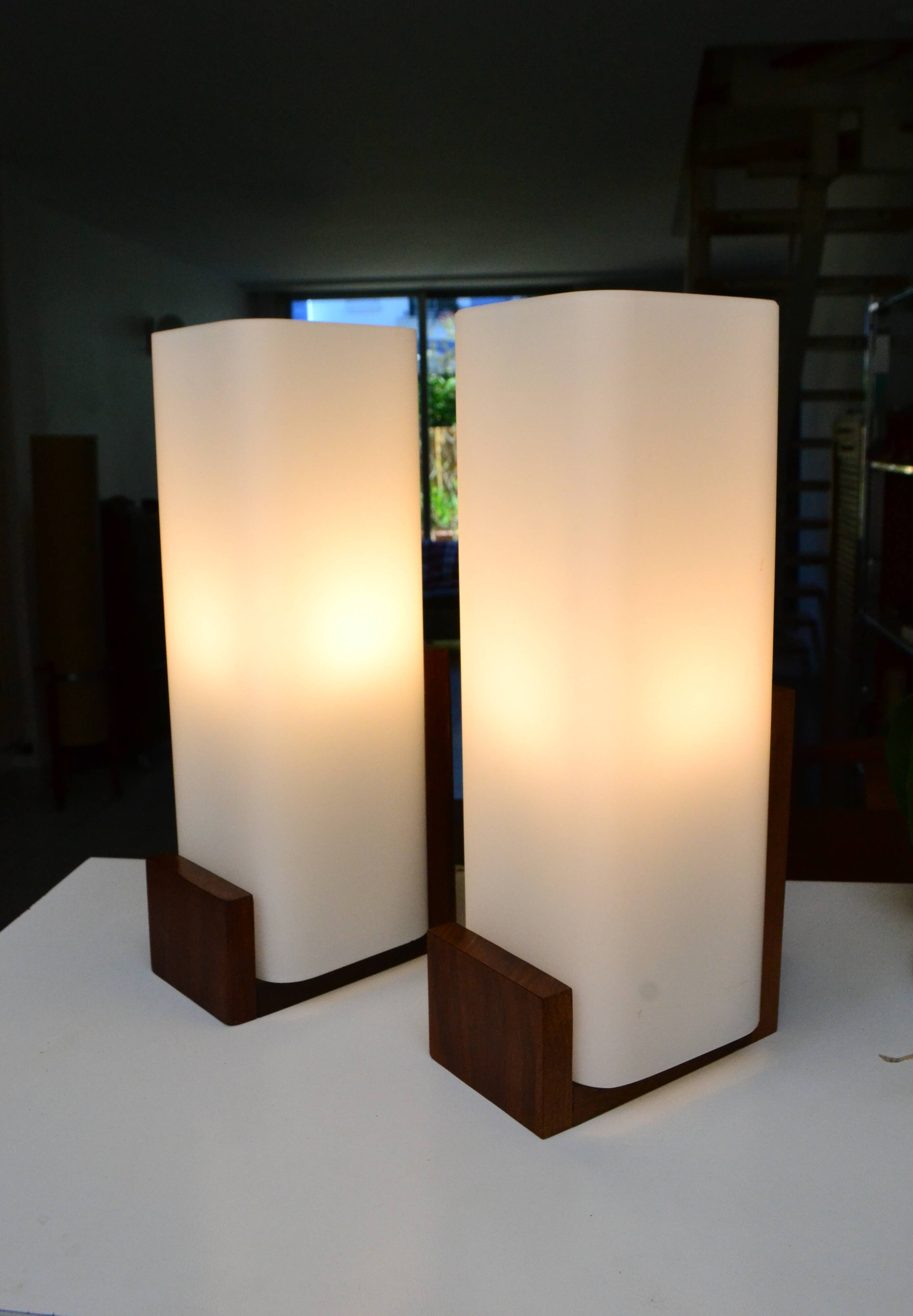 Pair of Louis Kalff wall lights, teak opalines from the 50s/60s.