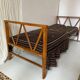 Two-seater bench convertible into a single bed.