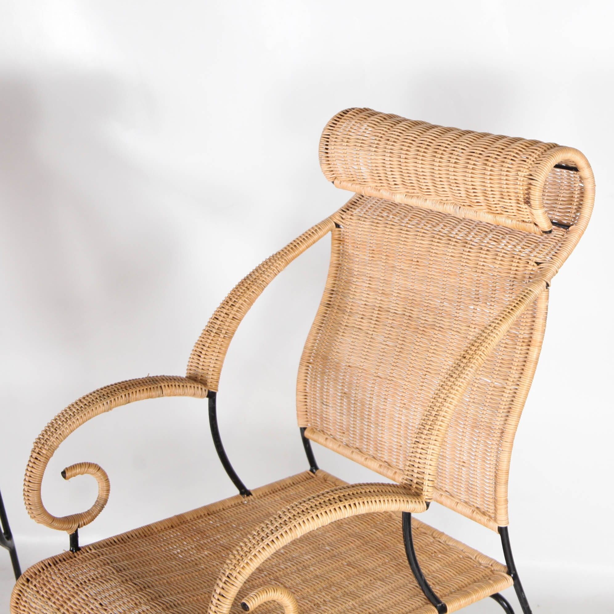 Pair of wicker and blackened iron armchairs