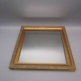 Small old mirror in wood and gilded stucco