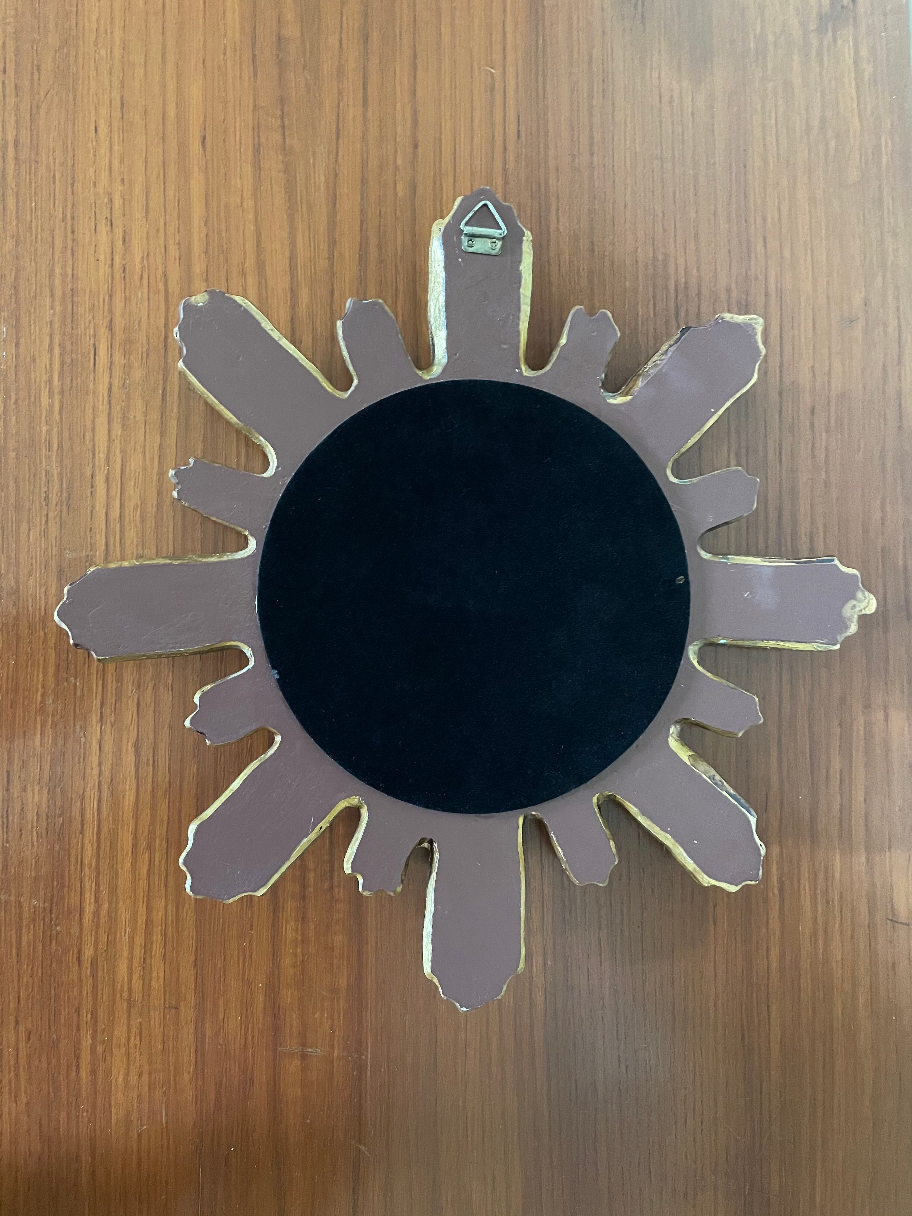 Vintage sun mirror in 60s/70s gold resin