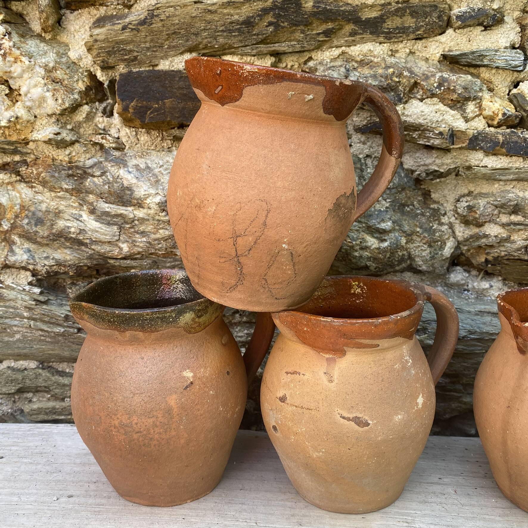 set of terracotta jugs country style