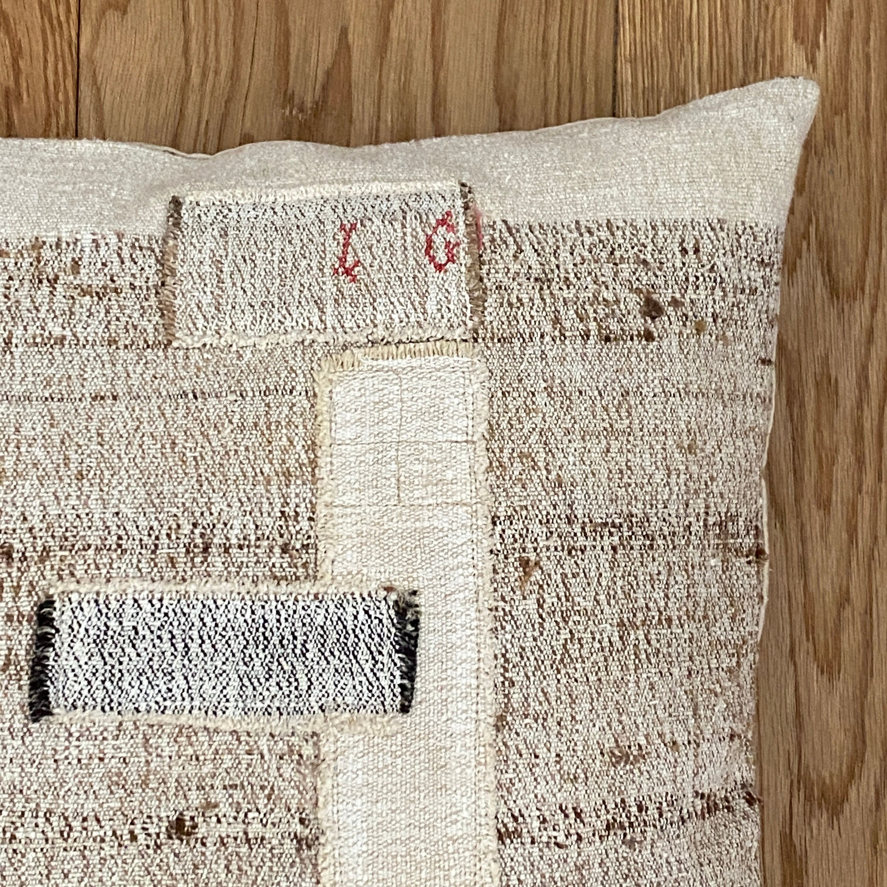 Old canvas cushion woven kilim style, patched