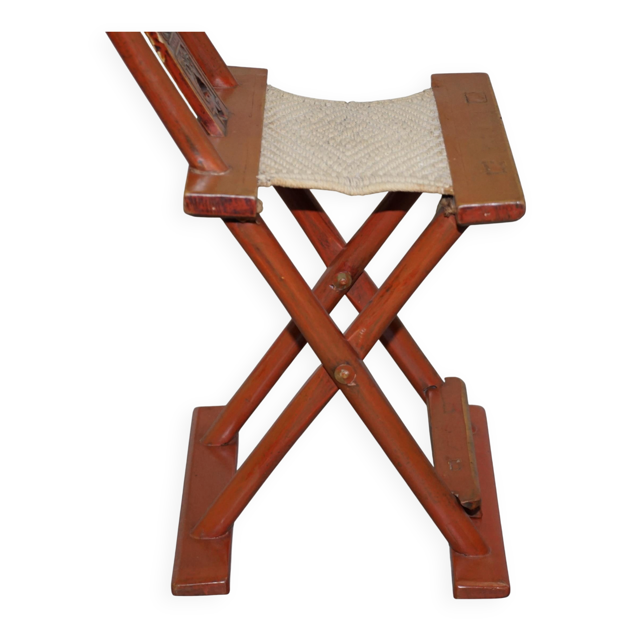 Antique Chinese folding chair with carvings, circa 1900-1920.