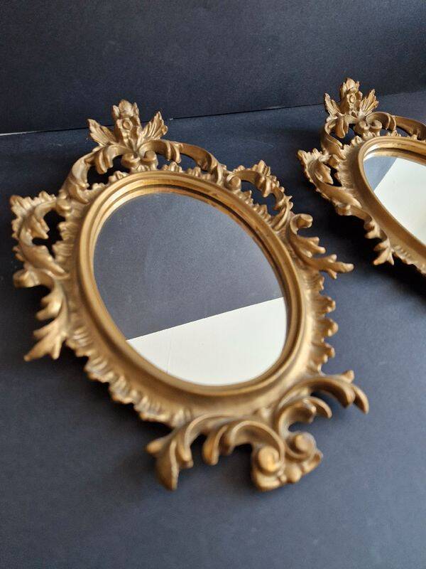 Pair of gilded rococo style mirrors, 1970s