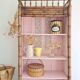 Library, old wooden cabinet imitating bamboo painted in pink