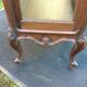 Louis XV Rocaille style showcase in solid walnut, beveled door glass.