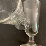 12 old glasses on foot at bistro or absinthe