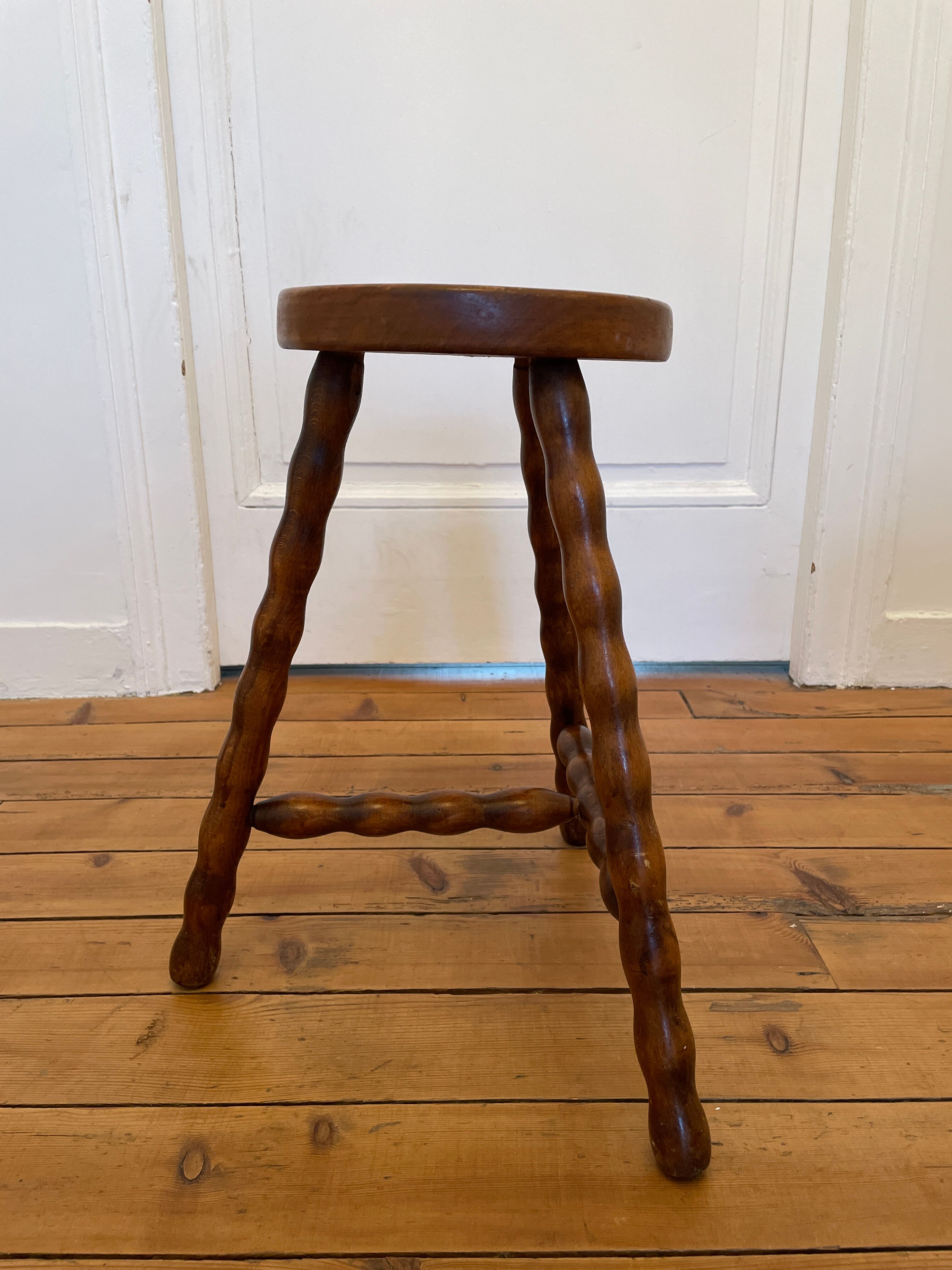 Old wooden tripod stool