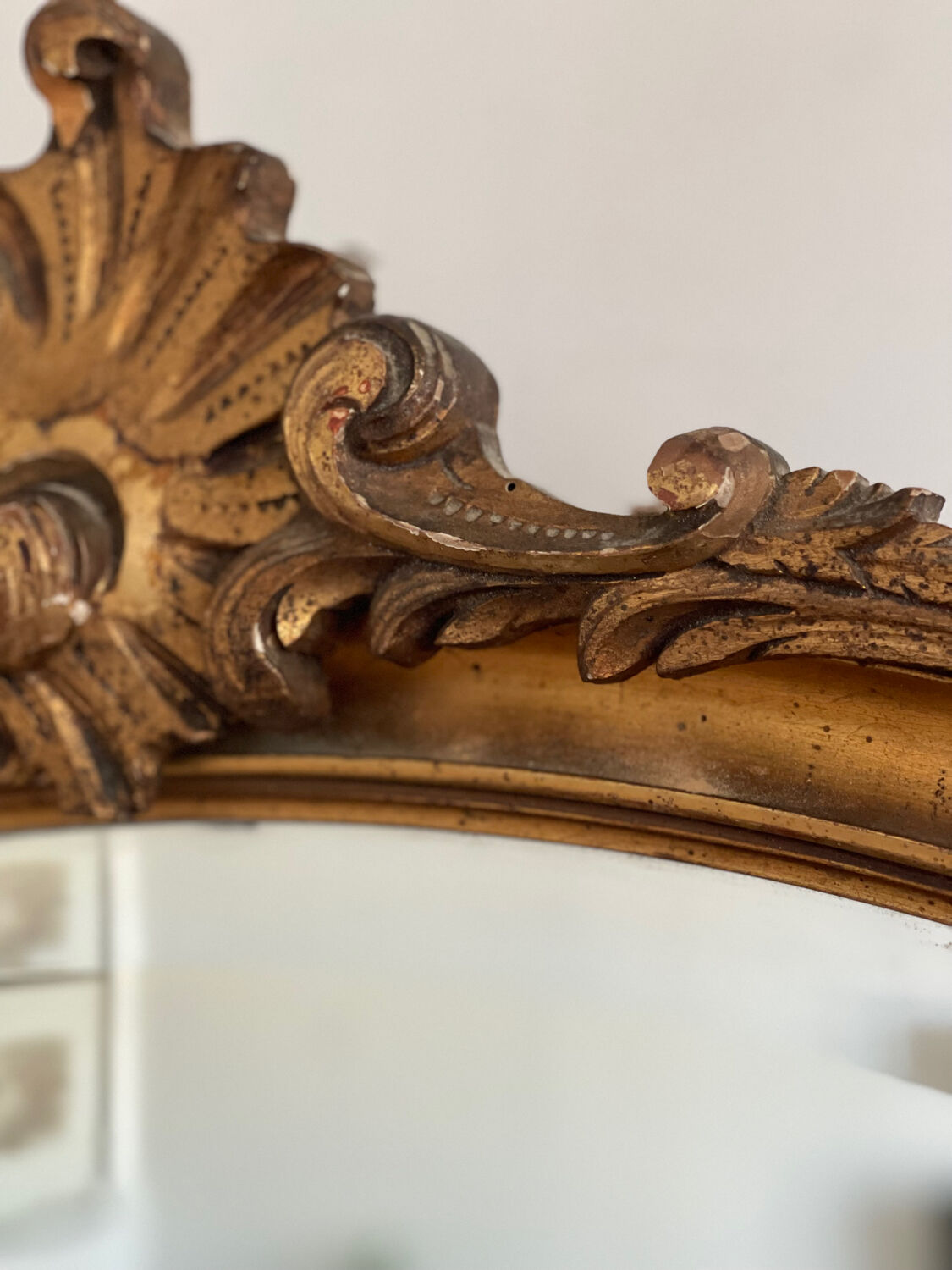 Antique oval gilt mirror.