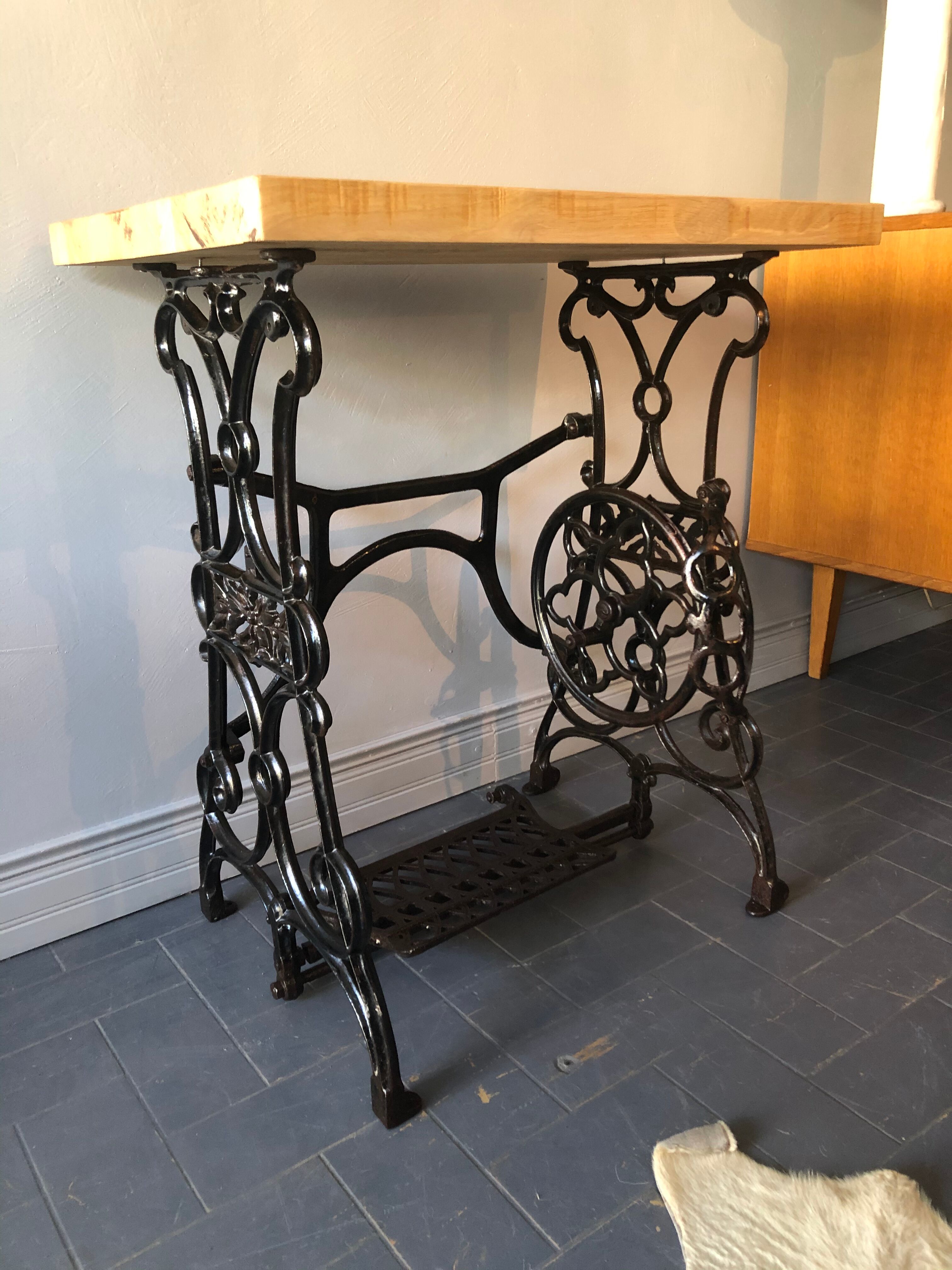 Ancient table, cast iron footing