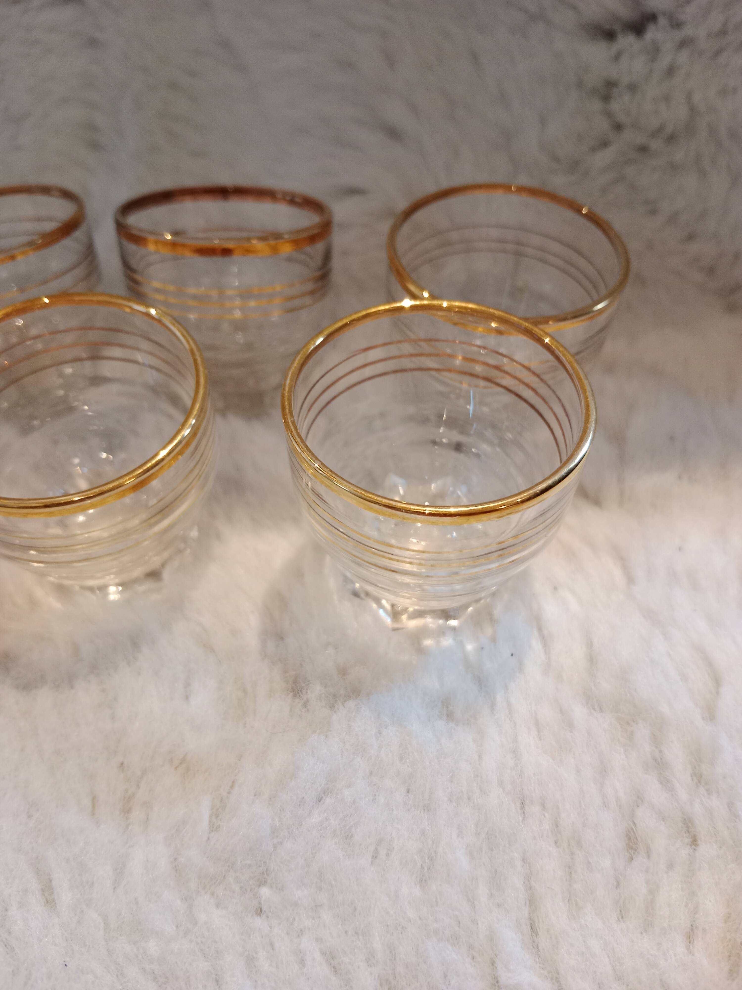 7 vintage mini shot glasses.