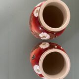 Pair of antique vases with butterfly and flower motif.