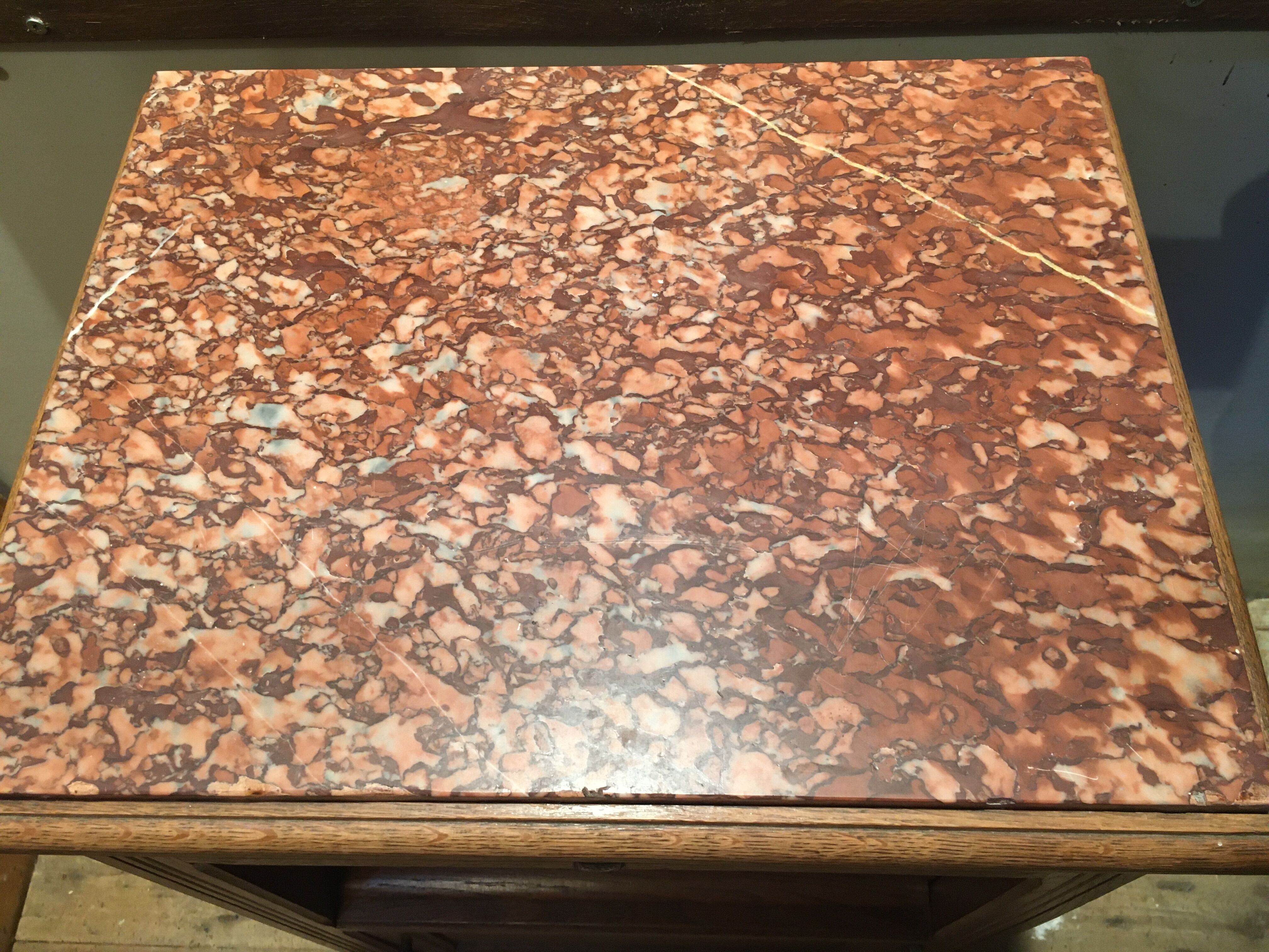 Solid oak bedside table with brown marble.