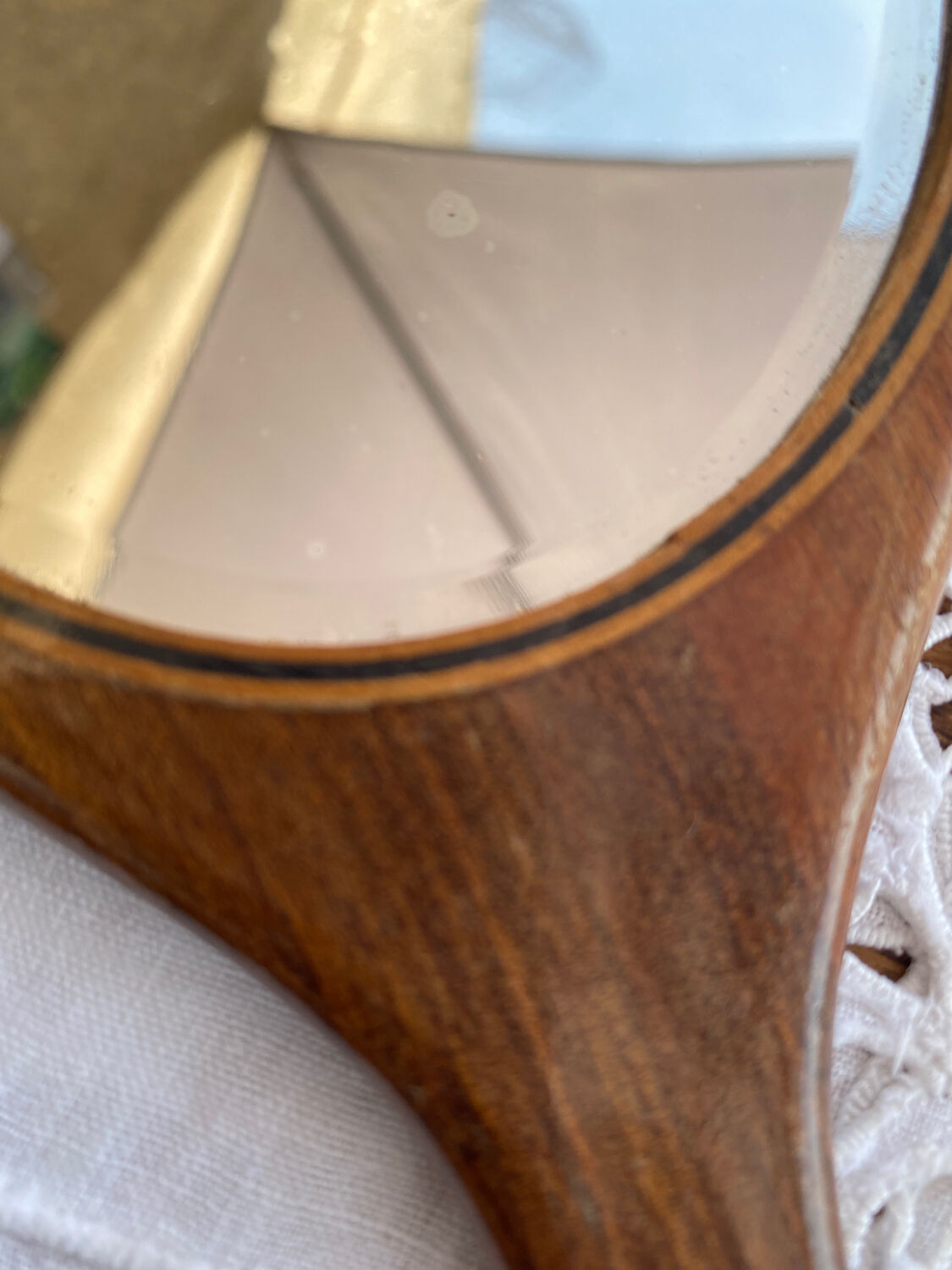 Hand-facing wooden mirror