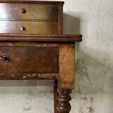Wooden lady's desk says "happiness of the day"