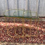 Suite of 3 trundle tables in golden brinze and glass slabs period 1970/1980