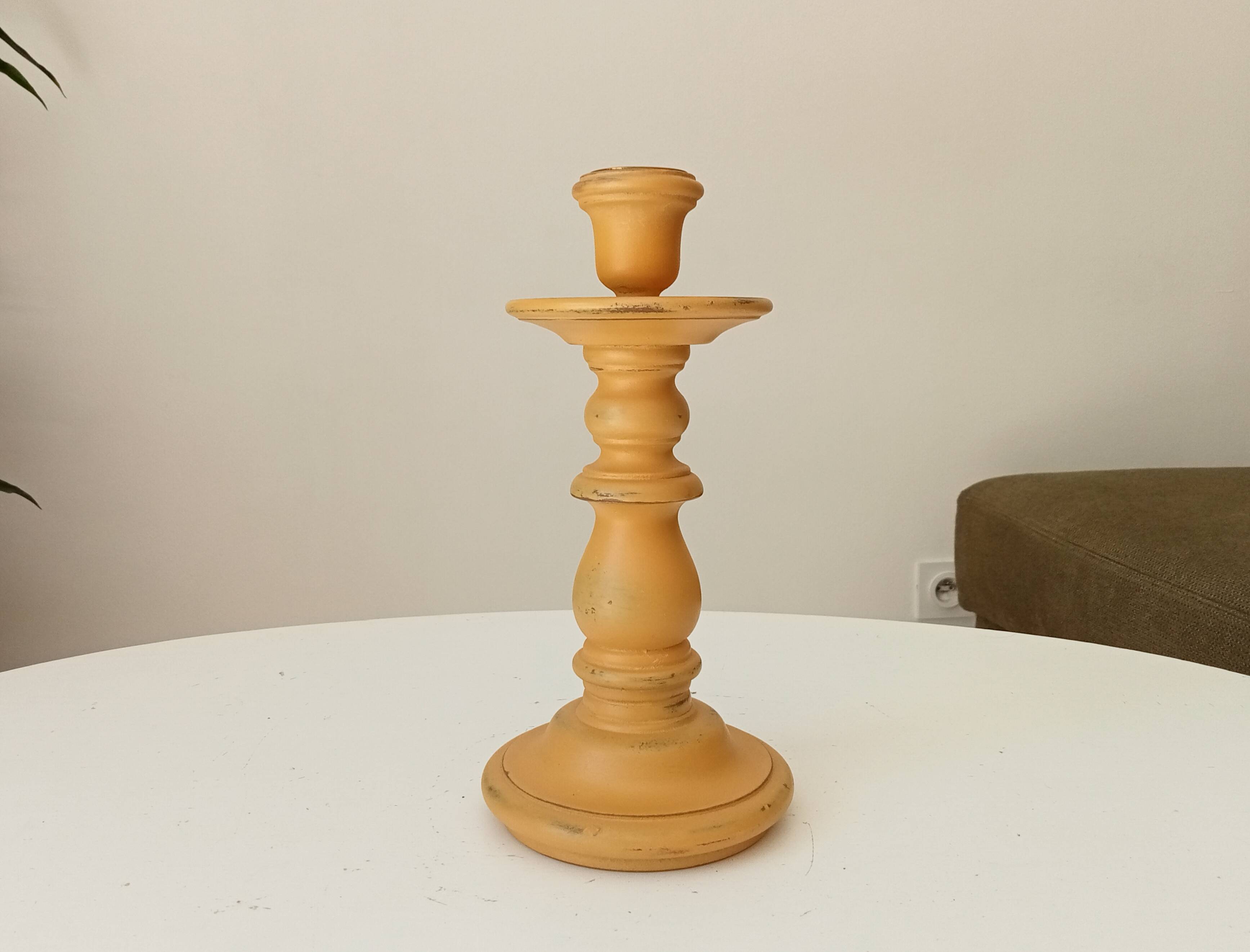 Vintage candle holder in weathered yellow wood