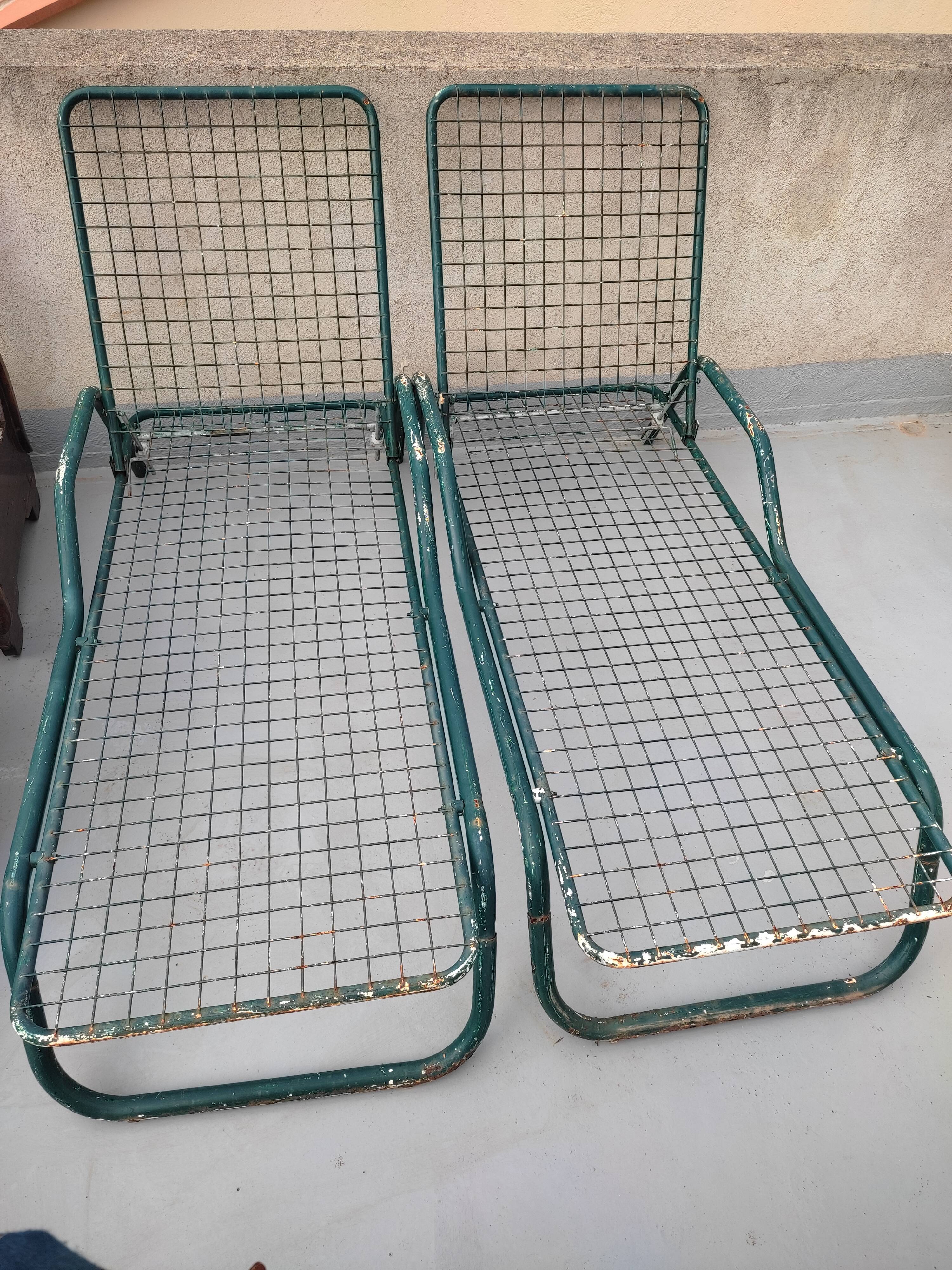 Pair of metal deckchairs