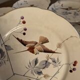 13 decorative plates with hummingbird design in fine earthenware by Mouzin Lecat, 19th century.