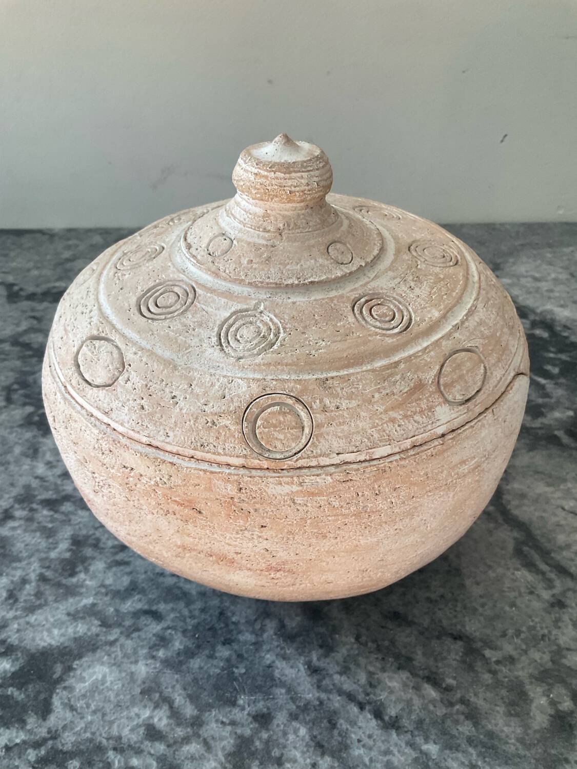 Vintage terracotta pot with lid.